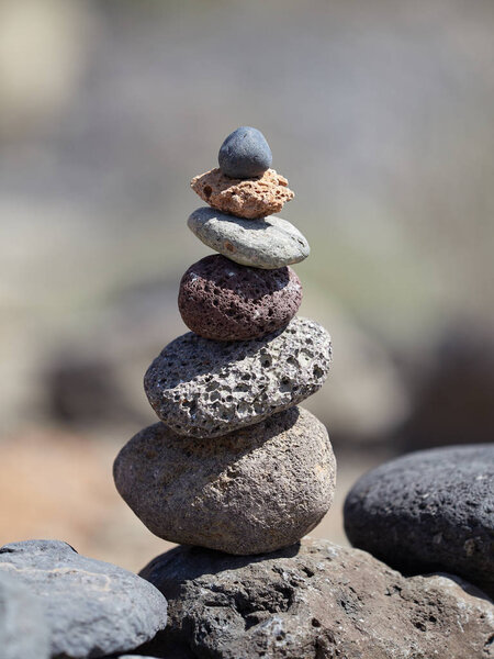 stack of stones on the beach - ancient ritual for good fortune and prosperity