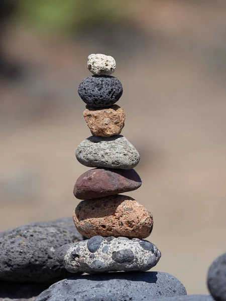 stack of stones on the beach - ancient ritual for good fortune and prosperity