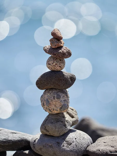 stack of stones on the beach - ancient ritual for good fortune and prosperity