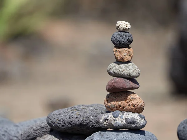 stack of stones on the beach - ancient ritual for good fortune and prosperity