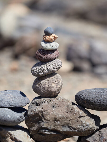 stack of stones on the beach - ancient ritual for good fortune and prosperity