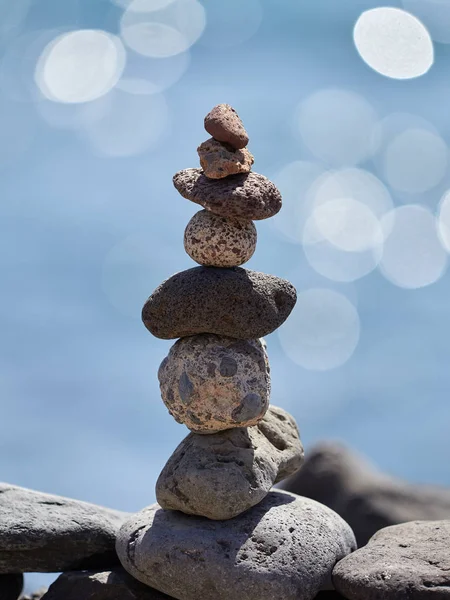 stack of stones on the beach - ancient ritual for good fortune and prosperity