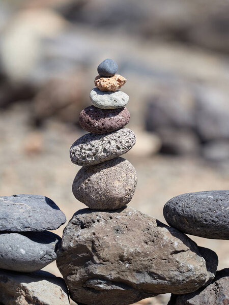 stack of stones on the beach - ancient ritual for good fortune and prosperity