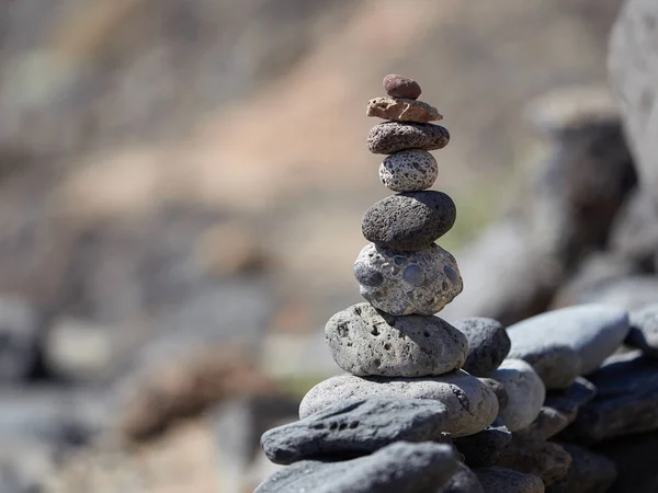 stack of stones on the beach - ancient ritual for good fortune and prosperity