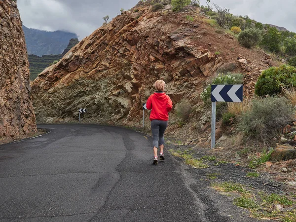 Trail Running Woman Mountain Nature Adventure Training Rocky Volcanic Rocks Stok Fotoğraf