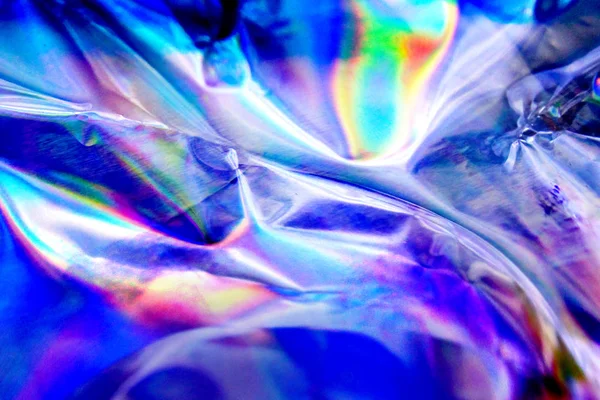 Fondo holográfico de textura de lámina iridiscente. Se puede utilizar para carteles, tarjetas, volantes, folletos, revistas y cualquier tipo de portada —  Fotos de Stock