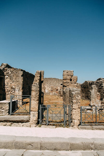 Destroyed ancient ruins of Pompeii. historical ruins with views on mount Vesuvius, Italy. Fossils and excavations, panoramic view of the city. Attractions and world heritage.