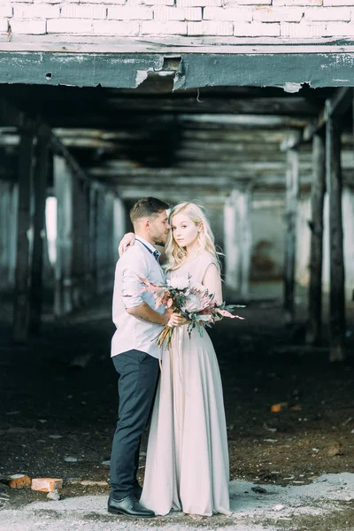 Wedding in European style on the farm. Old abandoned building. Fine art in the style of processing.