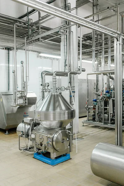 Production of milk and yogurt at the plant. Metal units and tanks for storage and transportation.