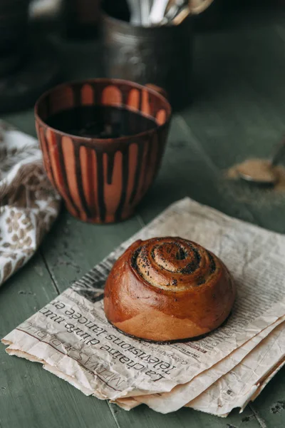 Buns and bread baking on dark wooden background. Food styling and cooking with fresh ingredients.