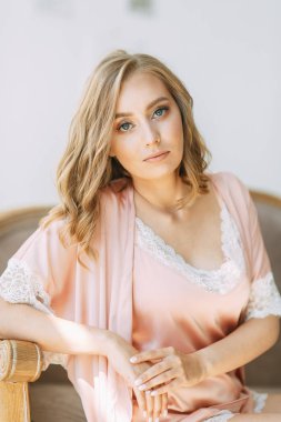  Fees and photo shoot in the interior Studio. Morning of the bride dress in the boudoir, in bed.