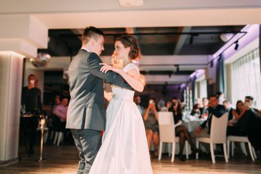 The first dance of a young couple. Wedding traditions in European style.