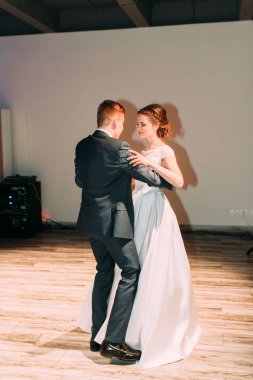 The first dance of a young couple. Wedding traditions in European style.
