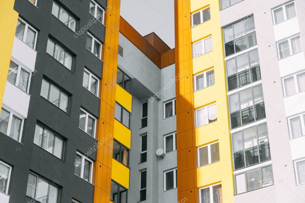 Parts of the facades of modern houses. Bright juicy colors in the construction of buildings.