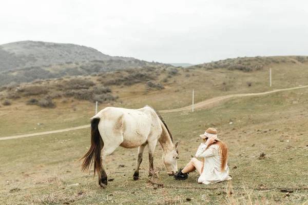 Beautiful girl with a horse. Nature and travel in the capital of Georgia.