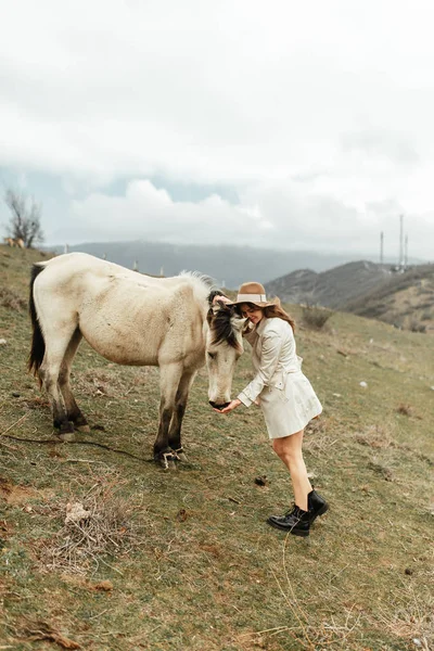 Beautiful girl with a horse. Nature and travel in the capital of Georgia.