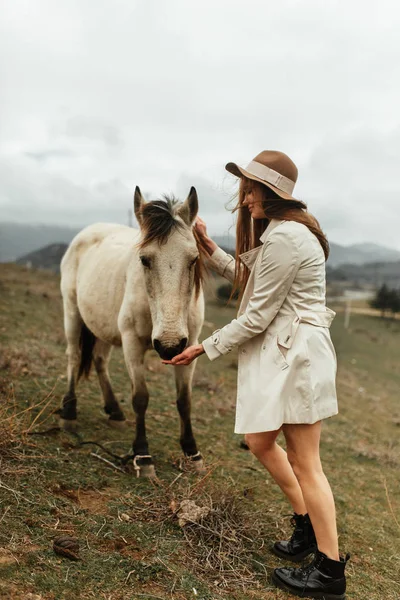 Beautiful girl with a horse. Nature and travel in the capital of Georgia.