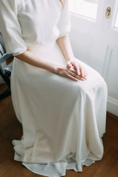 Light wedding photo shoot in the Museum. Beautiful bride in sitting in the Studio.