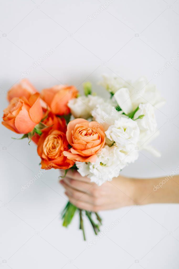 A bright modern bouquet on a white background. Wedding decor and minimalism.