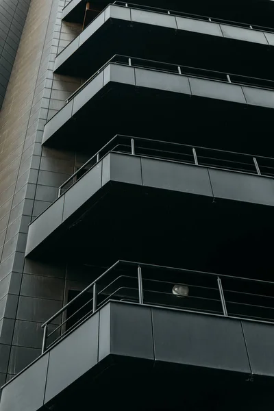 Minimalism in architecture and buildings. The black facade of the house and textures.