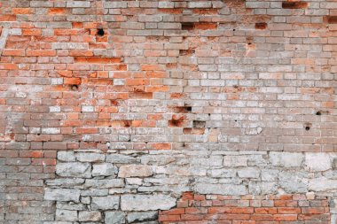 Eski evin dokulu duvarı. Boya ile eski tuğla duvar dokusu. 