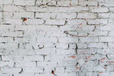 Eski evin dokulu duvarı. Boya ile eski tuğla duvar dokusu. 