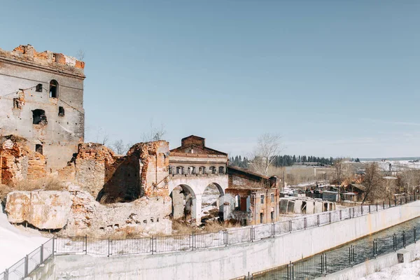 Destroyed historical building as in the war. Old abandoned factory outside.