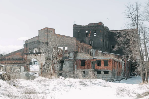 Destroyed historical building as in the war. Old abandoned factory outside.