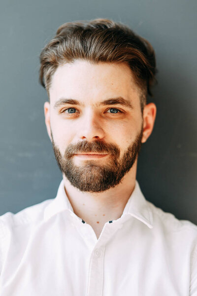 Expressive eyes of a man. Portrait of a stylish young man in the interior Studio. 