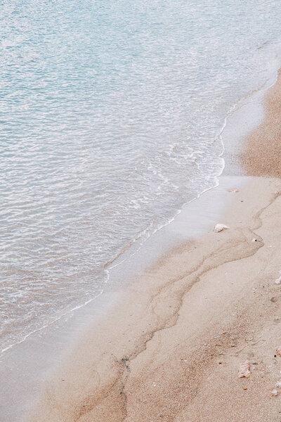 Minimalism of landscapes of Montenegro. Sandy beach and waves view from above. 