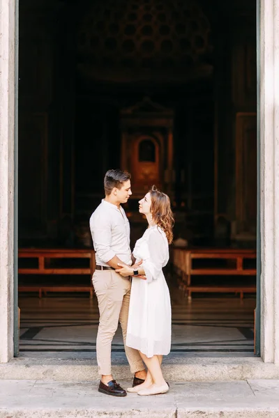 Beautiful stylish pair of in the European style. Wedding photo shoot on the streets of Rome.