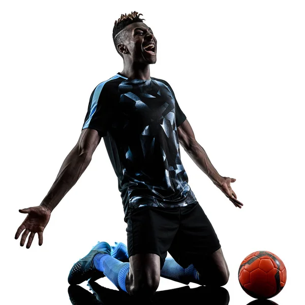 En afrikansk fotboll spelare man isolerade vit bakgrund silhouet — Stockfoto