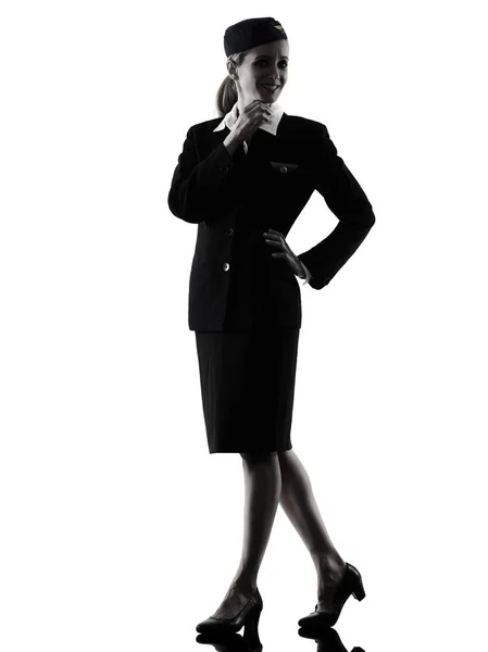 Stewardess cabin crew vrouw staande geïsoleerde silhouet — Stockfoto