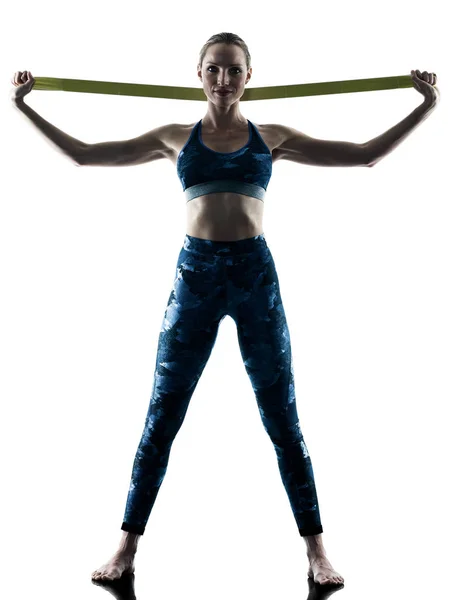 Donna fitness elastico esercizi silhouette Foto Stock