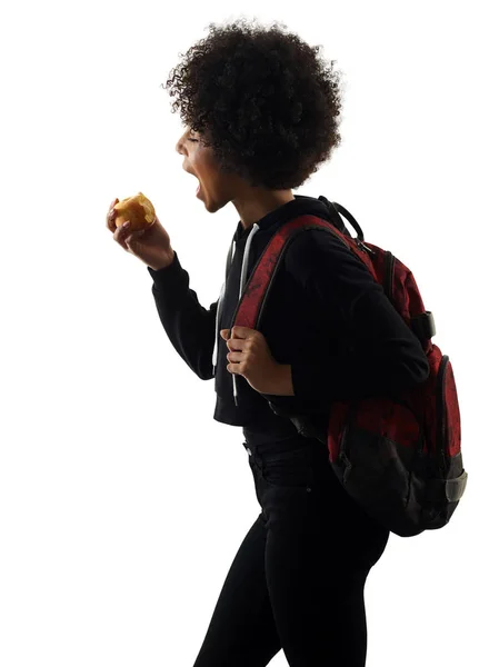 Joven adolescente chica mujer comer manzana sombra silueta aislar — Foto de Stock