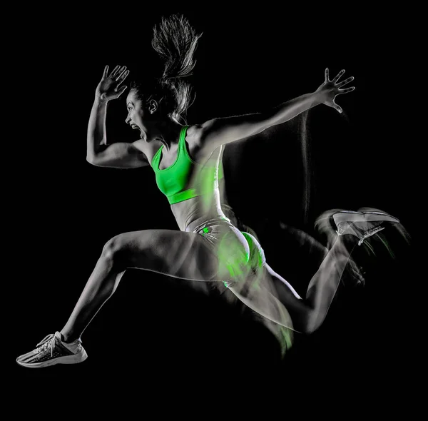 Mulher exercitando exercícios de aptidão isolado fundo preto efeito lightpainting Imagem De Stock