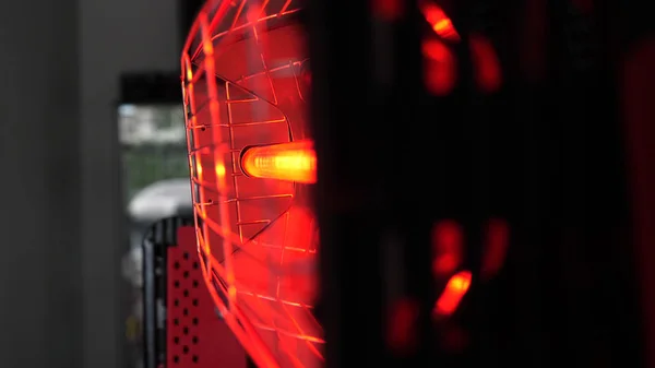 Infrared drying of car body parts after applying putty and paint on a white off-road vehicle in the body repair shop with red lanterns in the working environment. Concept of: Car Ceramic, Slow Motion.