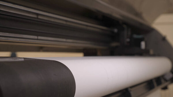 Industrial garment factory, a special Laser Cutting Fabric cuts out certain textile pieces. Concept of: Laser machine, Crosses, Work in a factory, Automatic cutting.