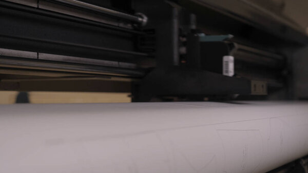 Industrial garment factory, a special Laser Cutting Fabric cuts out certain textile pieces. Concept of: Laser machine, Crosses, Work in a factory, Automatic cutting.