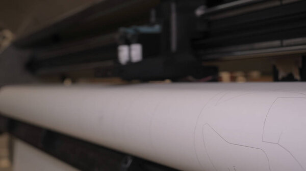 Industrial garment factory, a special Laser Cutting Fabric cuts out certain textile pieces. Concept of: Laser machine, Crosses, Work in a factory, Automatic cutting.