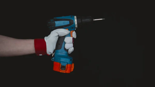 Laboratory work, the doctor holds a syringe, in a medical mask and glasses, takes a test from a test tube in blue rubber gloves, analysis, blood, DNA, a test tube holder.