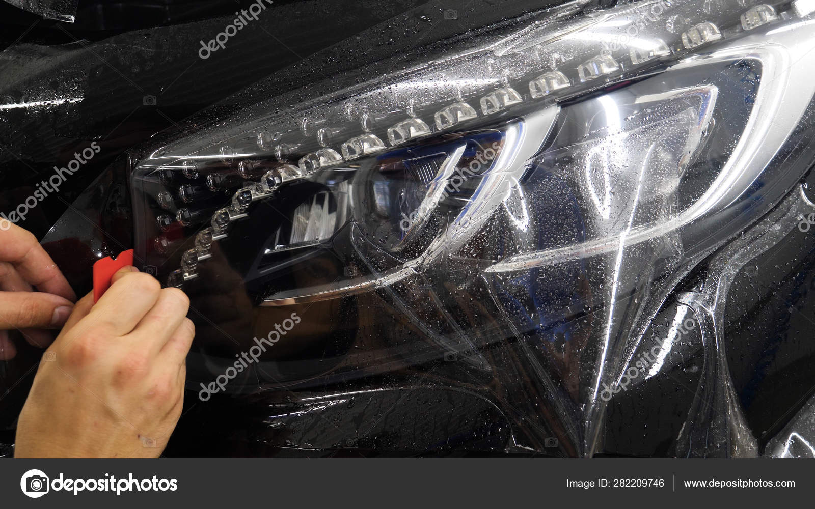 Close Ppf Installation Process Front Headlight Hood Ppf Paint Protection Stock Photo by