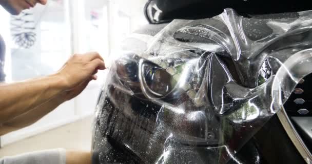 Close Ppf Installation Process Front Headlight Hood Ppf Paint Protection — Stock Video