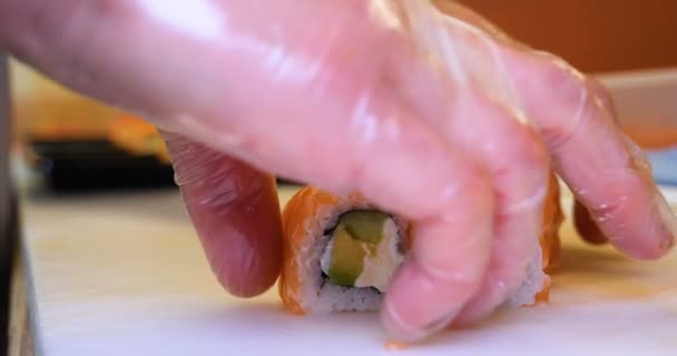 Close Professional Chef Hands Transparent Gloves Making Sushi Rolls Restaurant — Stock Video