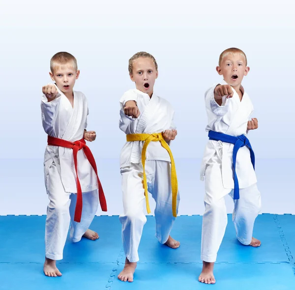 Three Athletes Karategi Beating Punch Arm — Stock Photo, Image