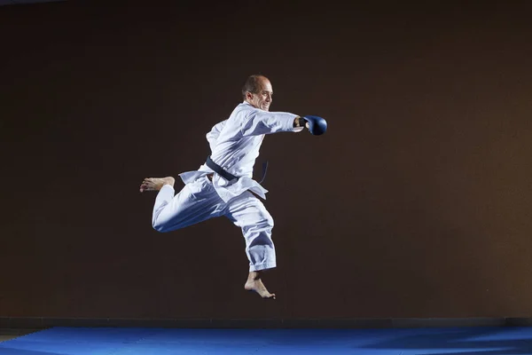 Blue Overlays Arms Athlete Trains Punch Hand Jump — Stock Photo, Image