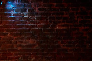 Blue light falls on the wall