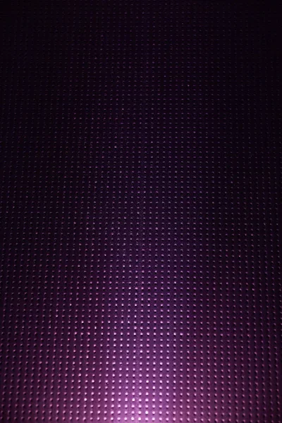 White light on a purple checkered background