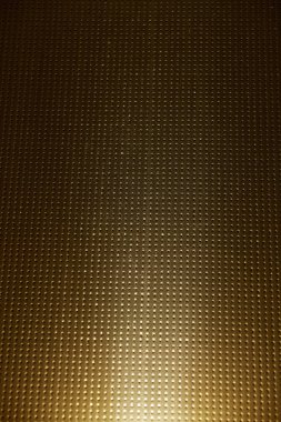 Kahverengi kareli arka plan üzerinde beyaz ışık