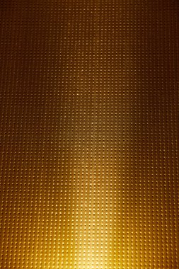 Altın, beyaz kızdırma bir damalı arka plan karşı